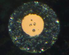 Hurlbutite crystals (centre) in the diamond anvil cell